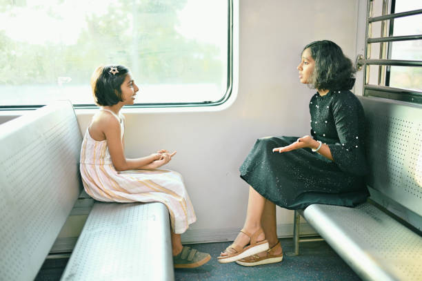istock Two girls enjoying a train ride 1415837583