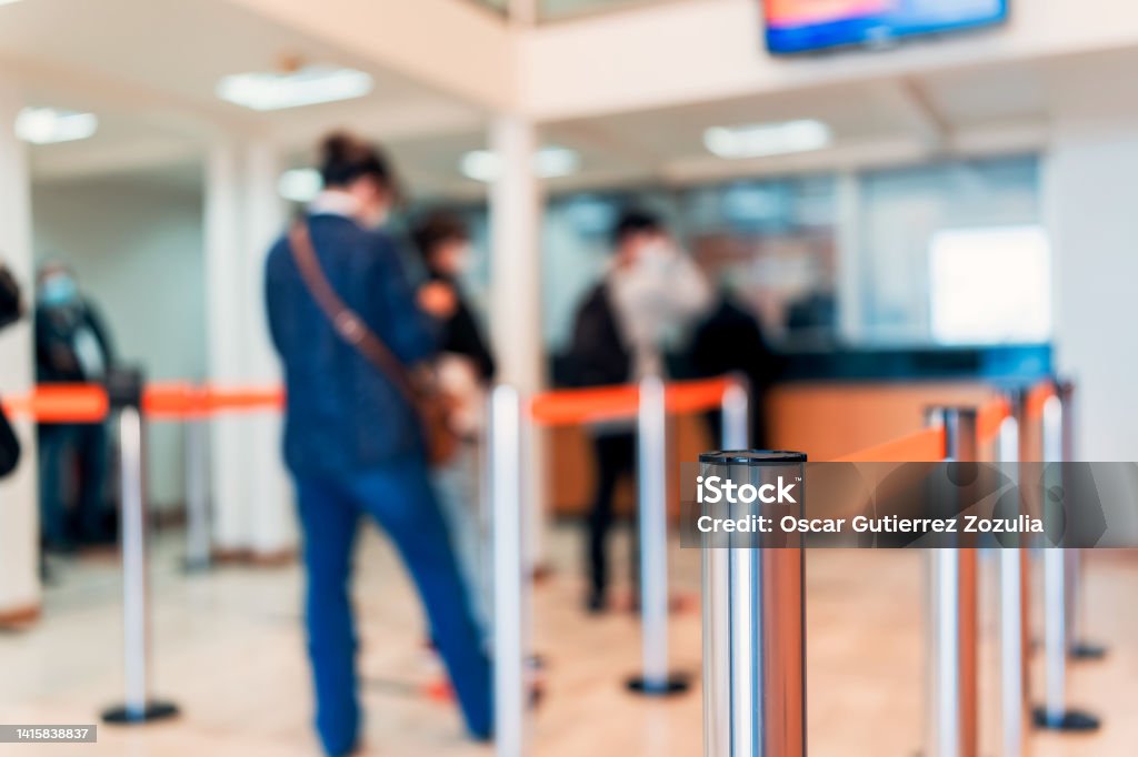 row of people to the bank teller cashier defocused background Banking Stock Photo