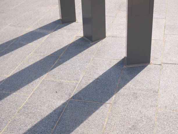 istock Light and shadow lighting of three poles on the urban ground 1415841424