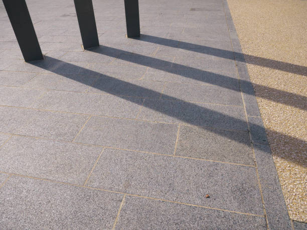 istock Light and shadow lighting of three poles on the urban ground 1415841426