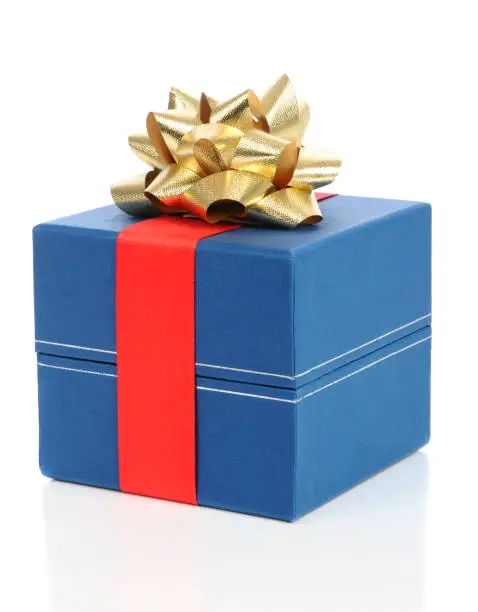 Blue Christmas gift with red ribbon and gold bow, over a white background.
