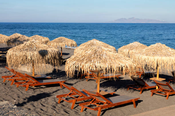 istock Umbrellas on Beach, Santorini, Cyclades, Greece 1415843342