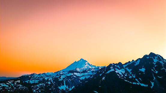 Mountain during orange sunset