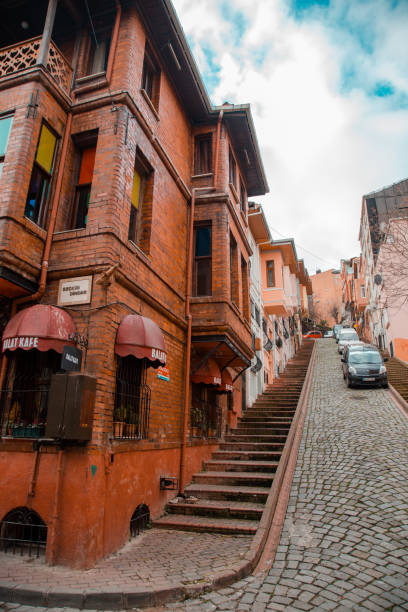 street with stairs with colorful houses in istanbul's balat district - balat stok fotoğraflar ve resimler