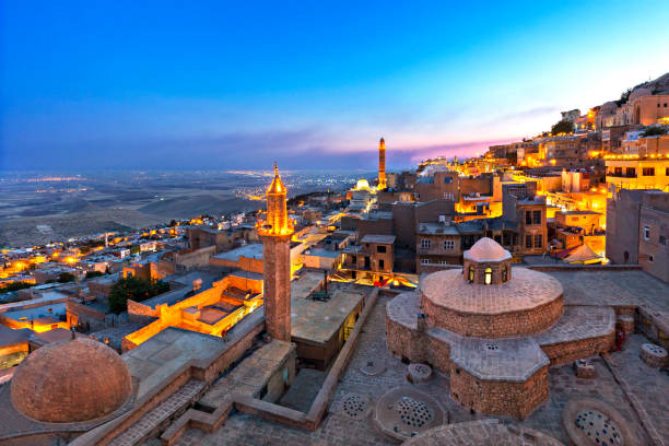 View over the city of Mardin at the twilight, Turkey Cityscape of the town of Mardin at the Blue Hour, Turkey midyat photos stock pictures, royalty-free photos & images