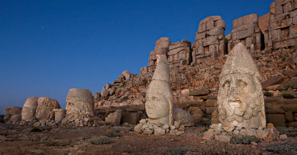Nemrut Mountain at the dawn in Adiyaman, Turkey Nemrut Mountain and giant statue heads from1st century BC, in Adiyaman, Turkey. nemrut dagi stock pictures, royalty-free photos & images