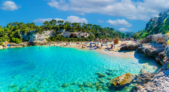 View of Cala Llombards beach with turquoise clean water in summer season, Mallorca Balearic islands, Spain