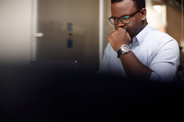 istock African American businessman using laptop while working in the office. 1415854996
