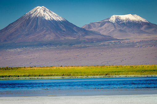 Licancabur volcanic landscape and salt lake reflection in Atacama Desert, Chile, South America