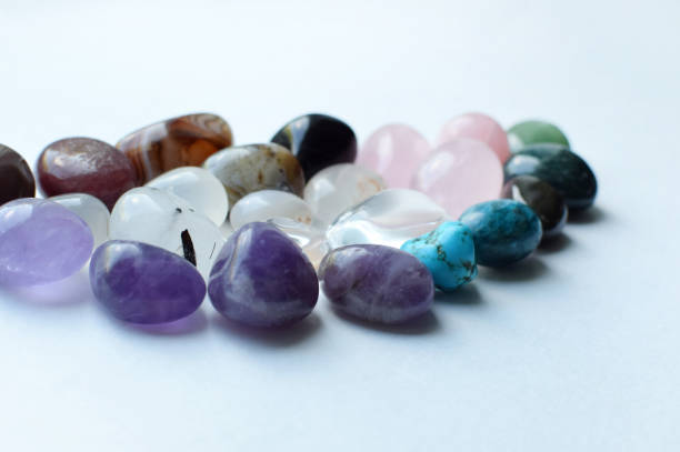 istock Gemstone minerals on a pink background. Round tumbling minerals amethyst, agate, turquoise on a white background. Selective focus. 1415859335