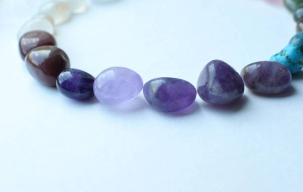 istock Gemstone minerals on a pink background. Round tumbling minerals amethyst, agate, turquoise on a white background. Selective focus. 1415859367