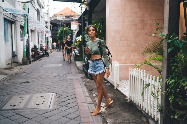 istock Content woman walking on street 1415862173