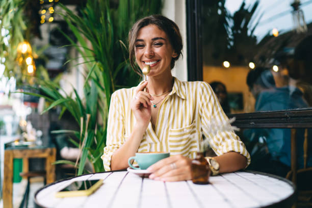 istock Cheerful woman with coffee and teaspoon 1415862207