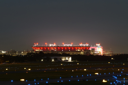 August 2022, Tampa, FL - Raymond James Stadium as seen from Tampa International Airport at night glows like an piece of art