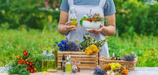 istock Woman with medicinal herbs and tinctures. Selective focus. 1415863870