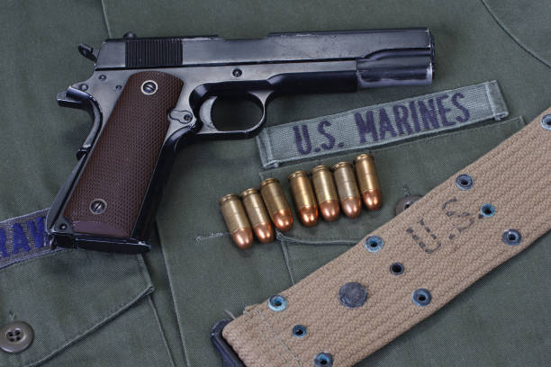 istock colt government M1911 with U.S. Marines uniform 1415868659