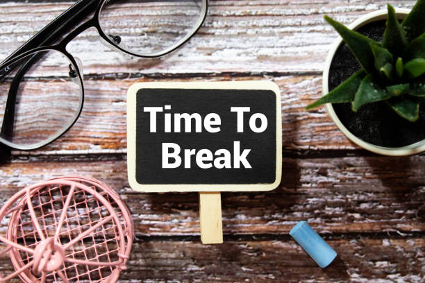istock Time to Break Text written on notebook page, pencil on the right. Motivational Concept image. 1415871679