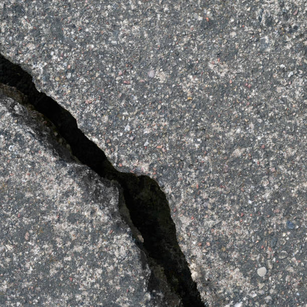 istock Old aged weathered cracked grey black tarmac texture pattern, large detailed damaged textured asphalt grungy background flat lay, vertical rough grained broken pattern macro closeup grunge copy space 1415877081