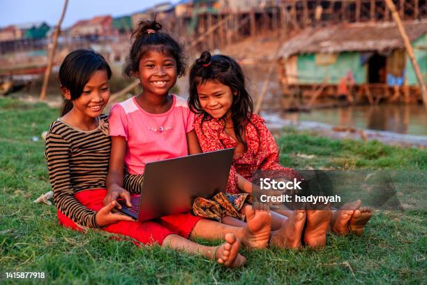 Happy Cambodian Girls Using Laptop In Village Cambodia Stock Photo - Download Image Now