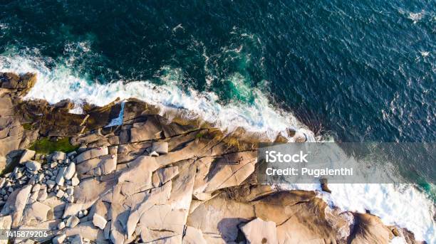 Waves Hitting The Rocks Aerial On Peggys Cove Nova Scotia Canada Stock Photo - Download Image Now