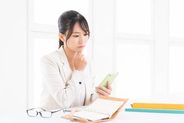 istock young asian woman who see a smart phone,think, 1415888017