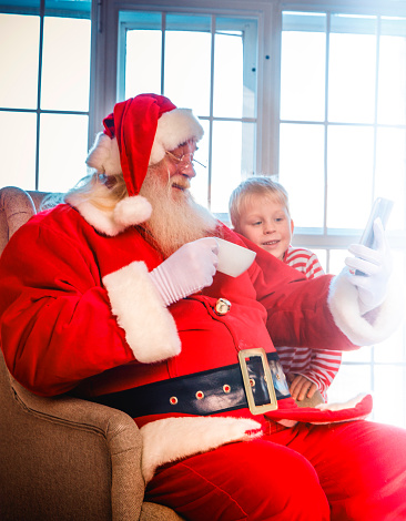Kids and Santa using digital devices