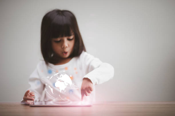 child using tablet on lap, burgundy tights visible, small hand resting on device cozy indoor moment showing youngster focused