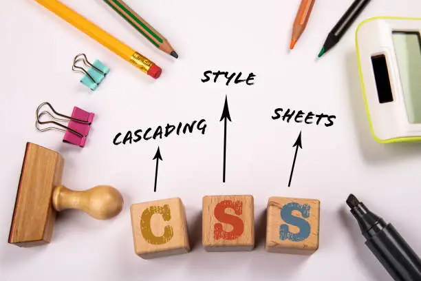 CSS - Cascading Style Sheets. Text on a white office table.