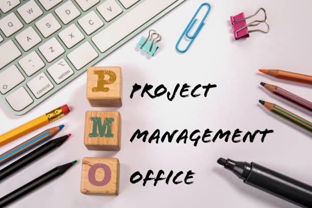 istock PMO - Project Management Office. Office supplies on the table 1415892341