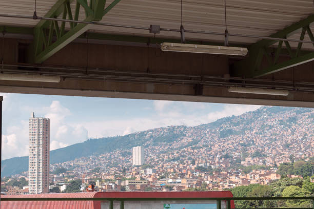 A city seen from a metro station on a sunny day. Medellin Colombia. Skyline of Medellin, Colombia seen from a metro station metro medellin stock pictures, royalty-free photos & images