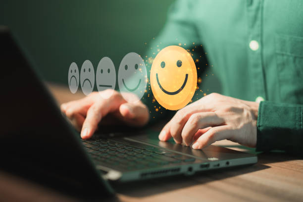 istock Man using a laptop in give rating to service experience on application. Online customer review satisfaction feedback survey. 1415895771