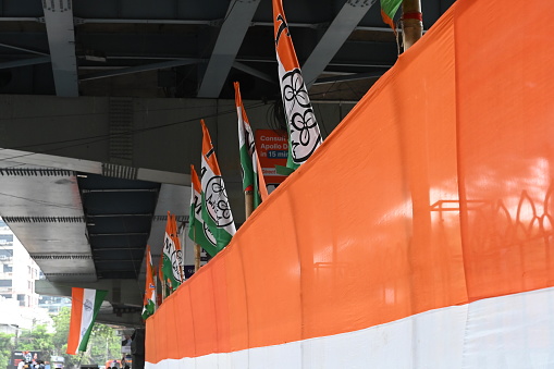 Kolkata, West Bengal, India - 21st July 2022 : All India Trinamool Congress Party, AITC or TMC, at Ekushe July, Shadid Dibas, Martyrs day rally. Colourful party flags hanging over.