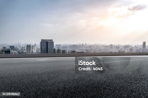 istock Highway skyline and city buildings landscape 1415908862