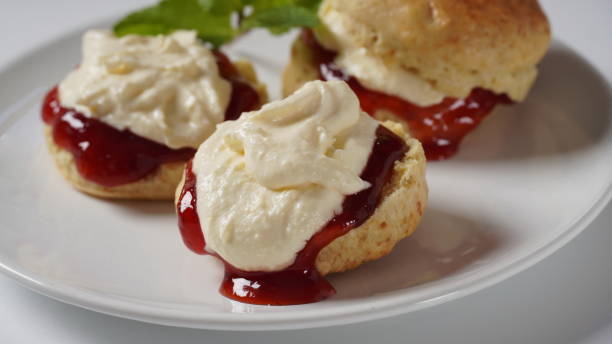istock British scones with fruit jam and whipped cream 1415910623