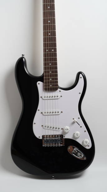 istock Black and white electric guitar on white background 1415911459