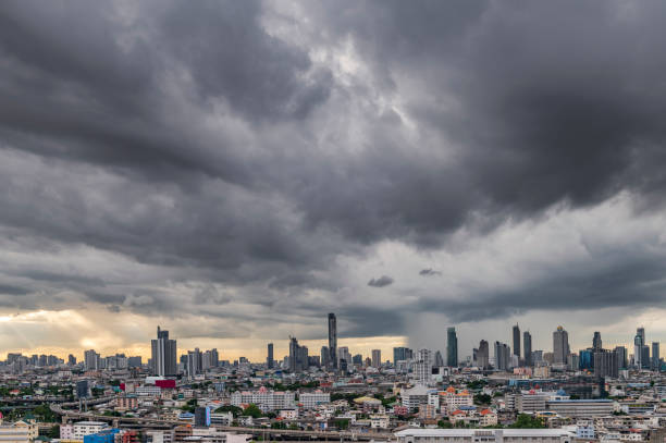 istock Modern city under dramatic stormy rainy clouds. 1415911799