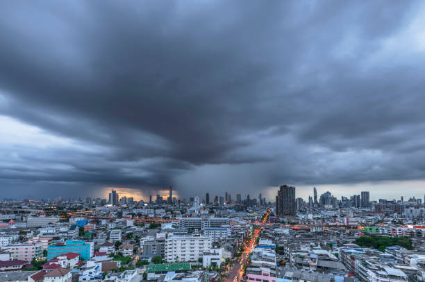 istock Modern city under dramatic stormy rainy clouds. 1415911810