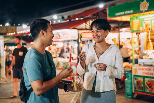 istock Friends on night market 1415914965
