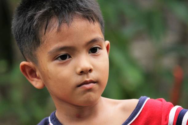istock Asian Thai little boy play in the backyard 1415919734