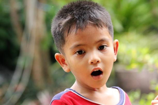 A cute Asian little boy laughed happily