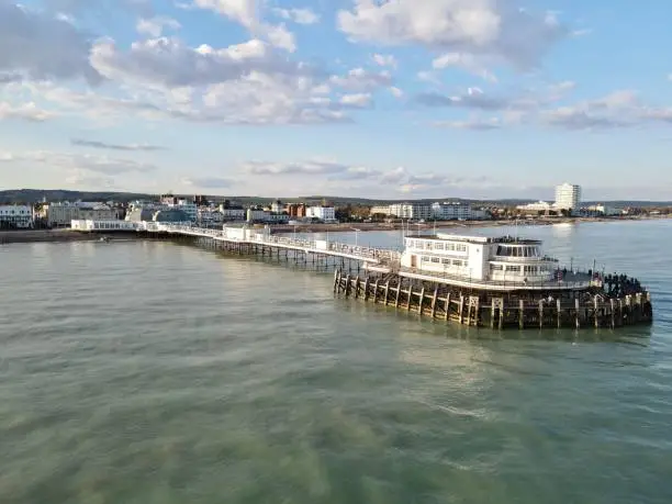 Drone photography of Worthing pier, UK. Taken from the sea looking inland at high tide