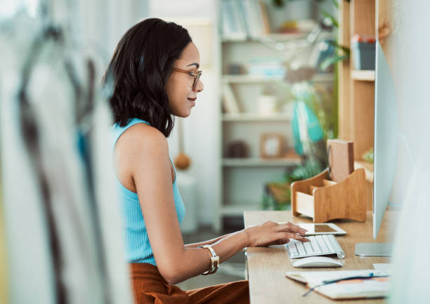 istock Typing, pc and entrepreneur sitting at desk while sending and checking client email. Startup, small business and manager of office online. Work at home professional and remote career using internet. 1415927207