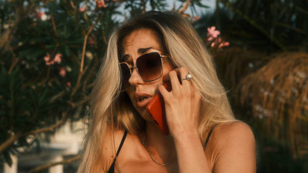 istock Business woman solves business issues on the phone 1415929347
