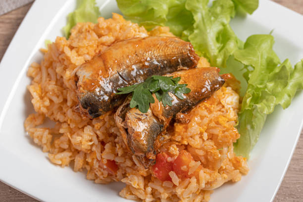 istock Fried rice with canned fish in a white plate.Thai food 1415929413