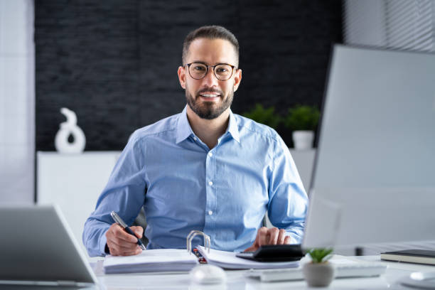 Tax Accountant Advisor Man Doing Sales Invoice Tax Accountant Advisor Man Doing Sales Invoice Accounting accountant stock pictures, royalty-free photos & images
