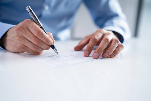 istock Writing Money Cheque. Sign Check 1415930113