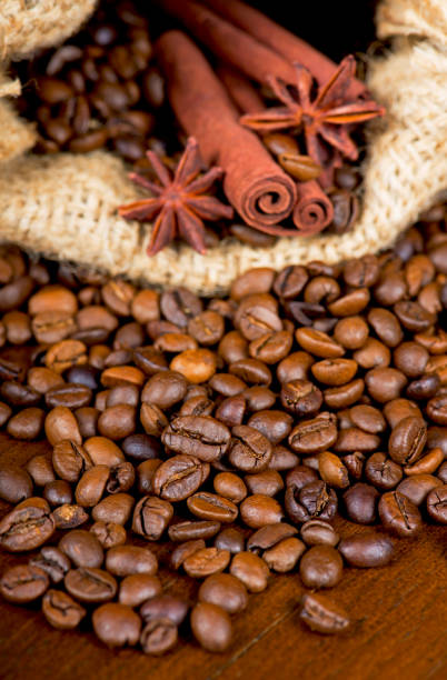 coffee beans, cinnamon sticks and star anise dark background.