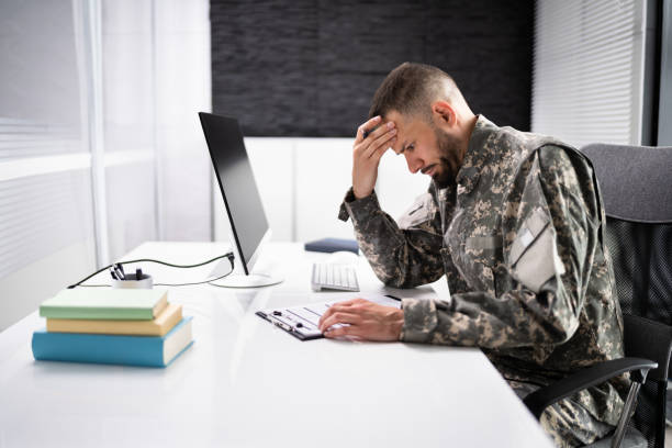 istock Sad Frustrated Military Veteran Student Doing Test 1415932618