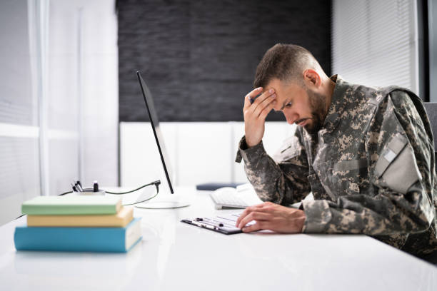 istock Sad Frustrated Military Veteran Student Doing Test 1415932622