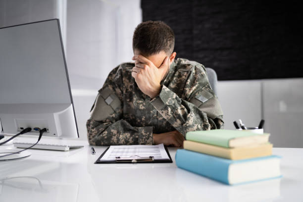 istock Sad Frustrated Military Veteran Student Doing Test 1415932633